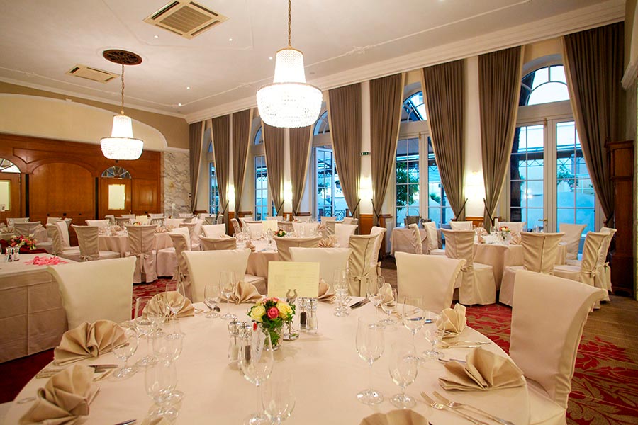 Dining room with chandelier and round tables